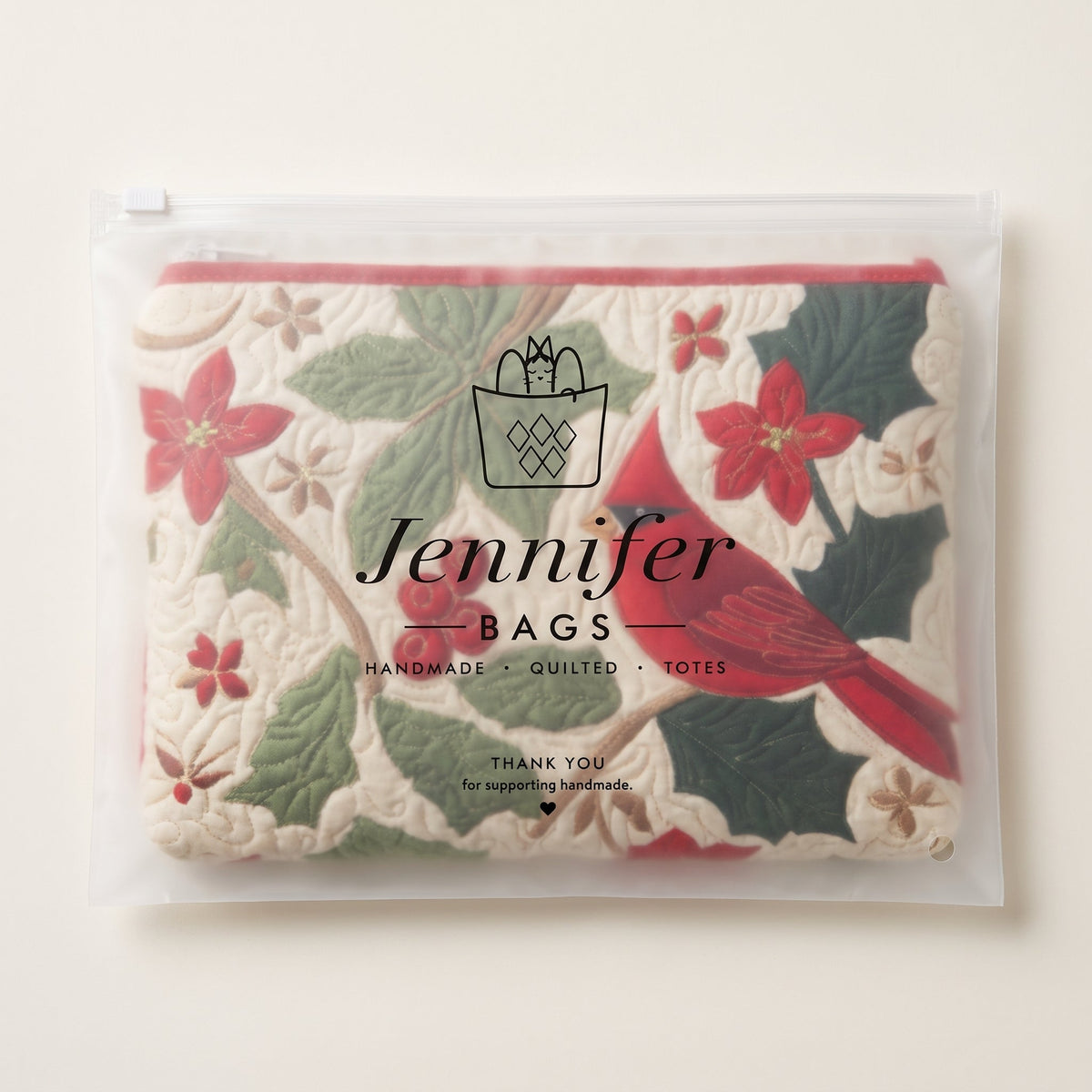 Holly Cardinal Quilted Makeup Bag — packaged in its Jennifer Bags pouch