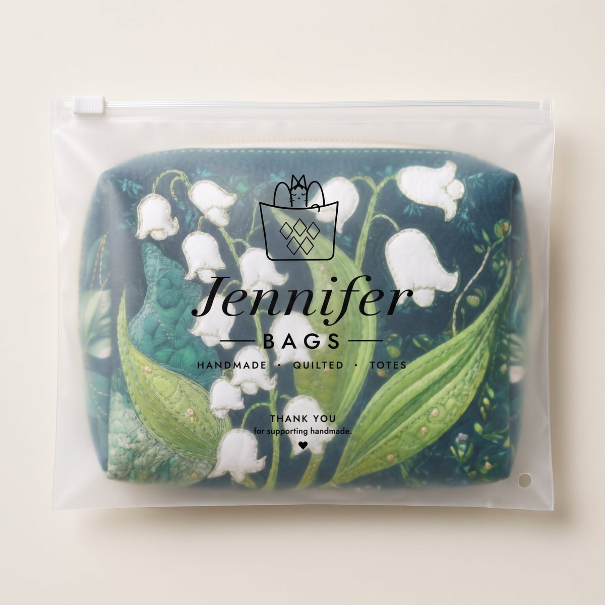 Lily Grace Quilted Makeup Bag — packaged in its Jennifer Bags pouch
