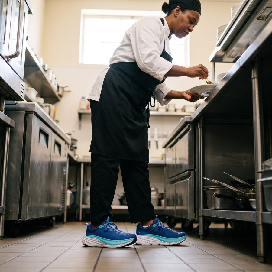 Again Lift in Blue, worn by a line cook on the kitchen line