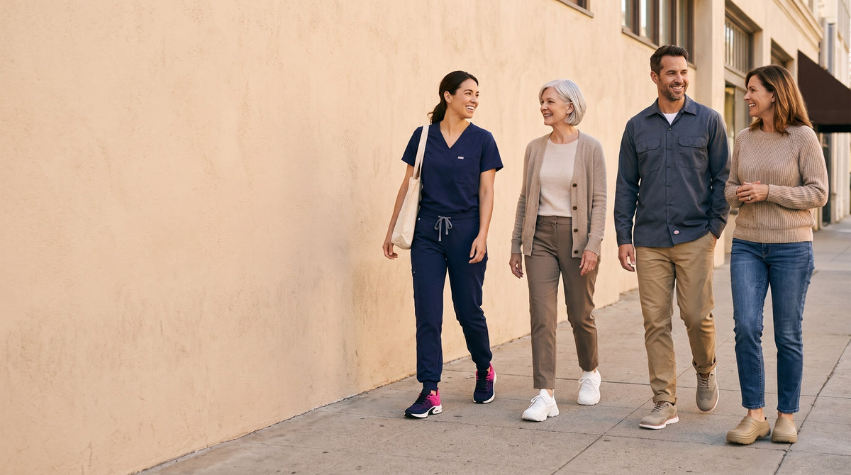 Four people of different ages walking along a sunlit street in Again shoes: a nurse in scrubs, an older woman, a man in work clothes and a woman in jeans